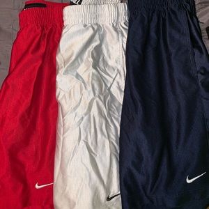 Three medium nike basketball shorts